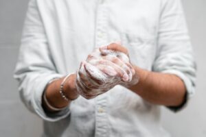 close up of hands lathered in soap